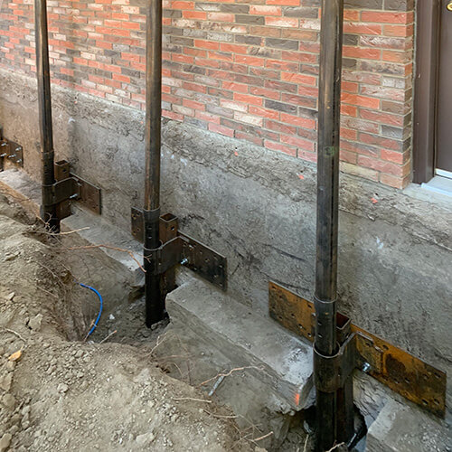 Screw piles used to repair a foundation